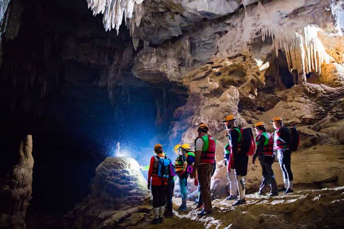 Learning about limestone formations in Hang Kim