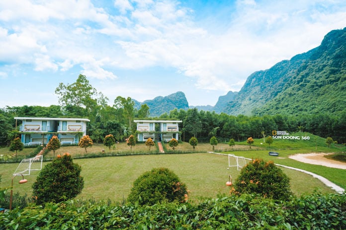 Chay Lap farmstay backyard surrounded by a chain of limestone mountain