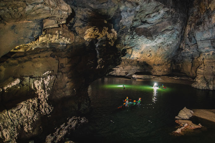 Swimming in underground river of Hang Ken Cave