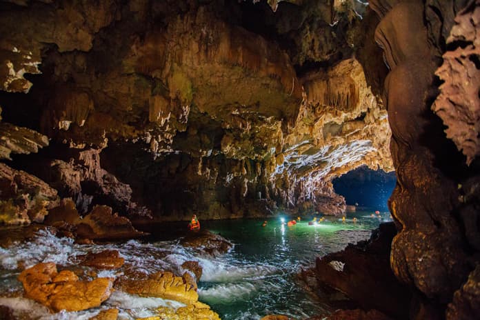 Swim in the underground river in Kim Cave.