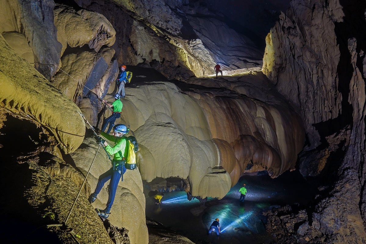 Traversing to discover cone towers in Hang Va Cave.