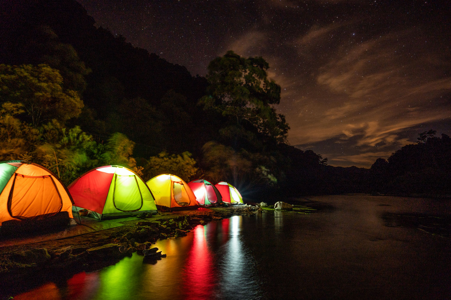 Sparkling Hang Tien Cave campsite at night