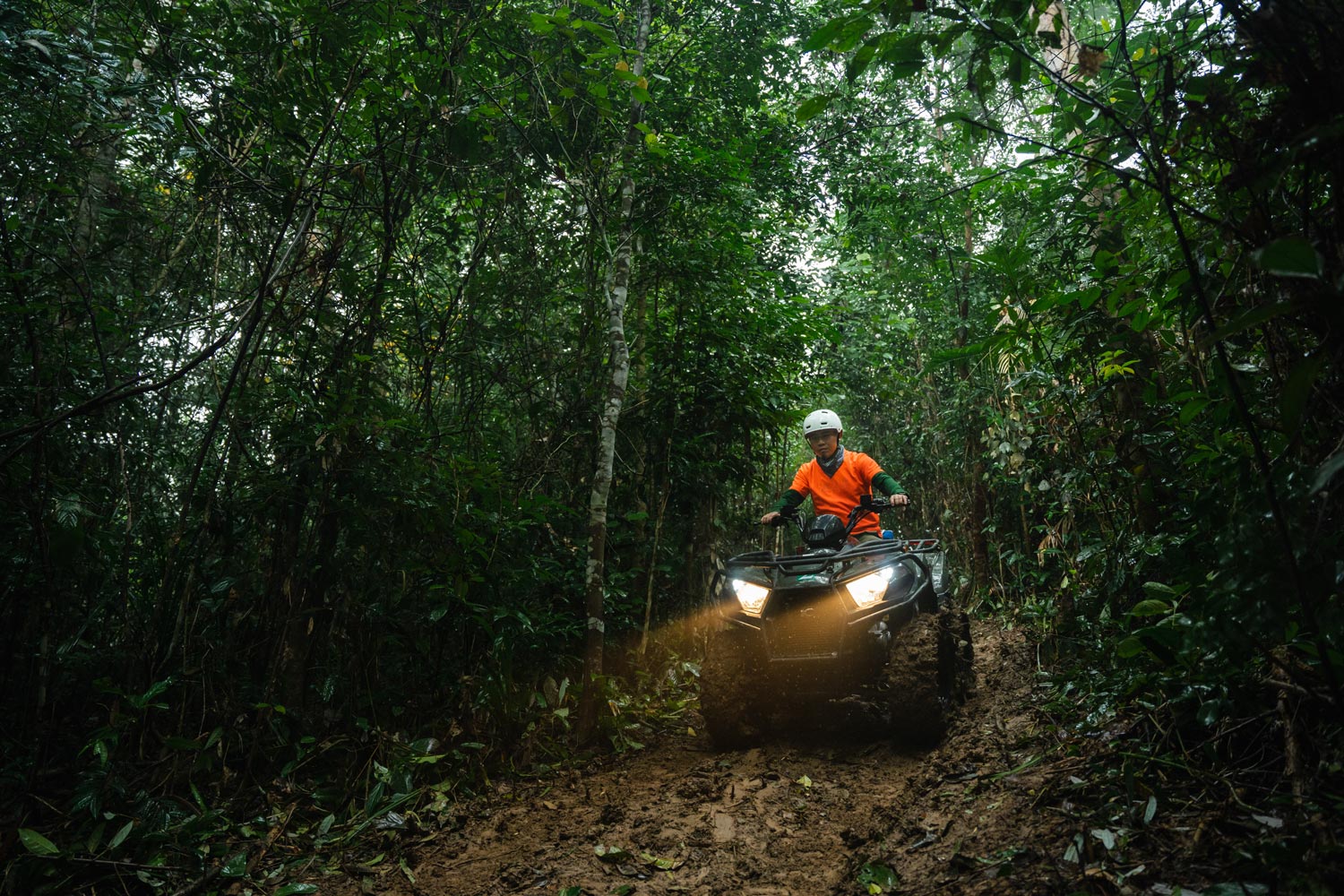 Participating in ATV driving to explore Tan Hoa's Lim forest.