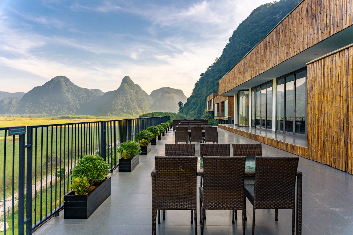 The restaurant offers stunning views of the rolling fields and the distant mountains.